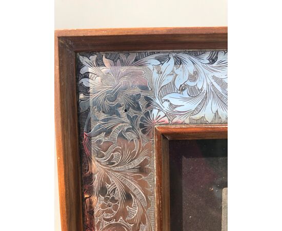 Frame in walnut and silver with stylized plant motifs. Italy.     