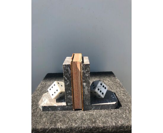 Pair of marble bookends depicting game dice.     