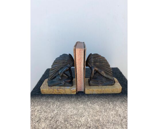 Pair of metal and marble bookends depicting two Red Indians.     