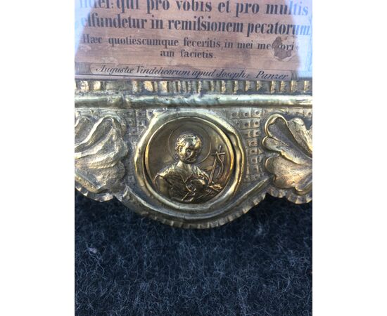 Cartagloria in wood with brass foil with tondo depicting Christ and Saints.     