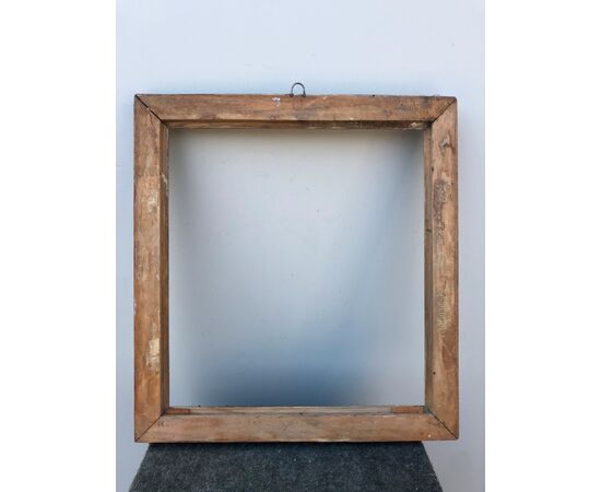 Frame in carved and silvered wood.     