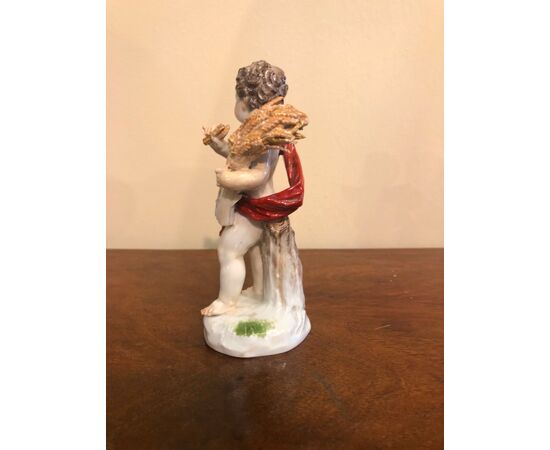 Porcelain figurine of male figure with ears of wheat.Meissen.     