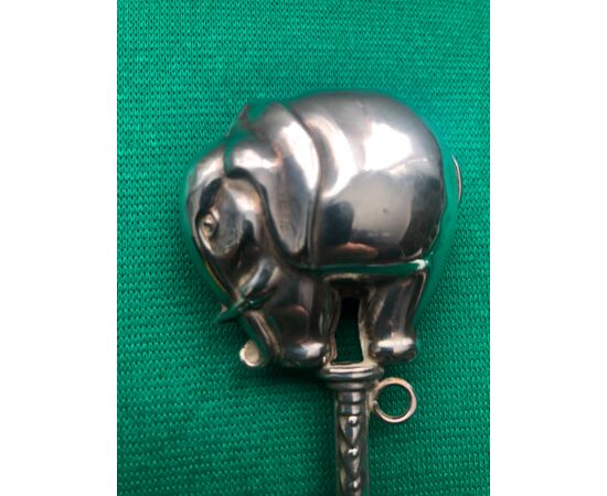 Silver baby rattle with elephant figure.     