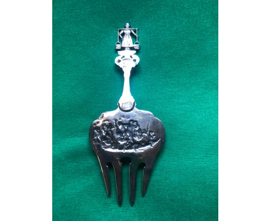 Fork in embossed silver with characters on a boat, mascarons and stylized plant motifs. Holland 1860.     
