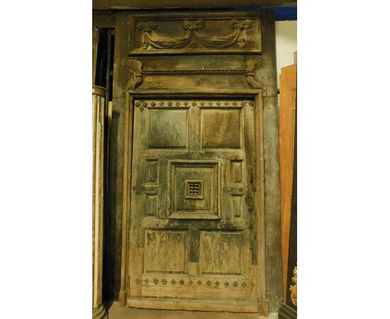 ptn205 door with carved portal, in walnut, meas. h 290 x 168 cm max     