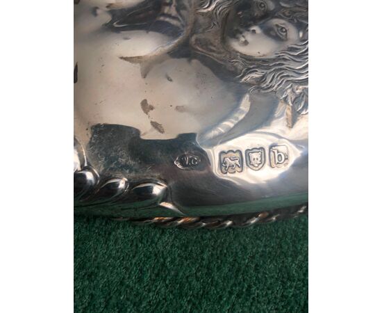Embossed silver mirror with cherub motif London 1897.     