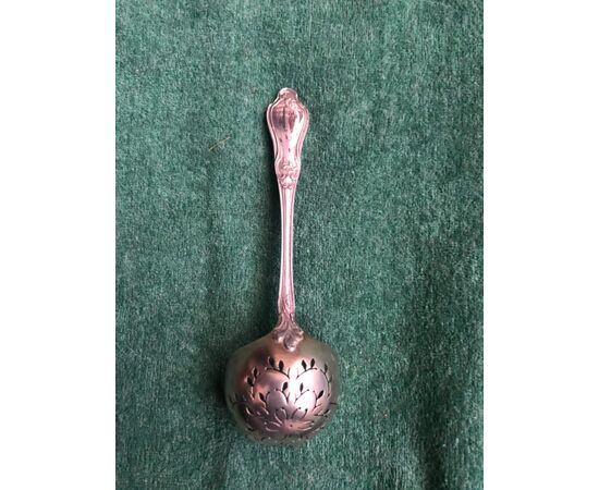 Tea strainer in silver with floral motifs. France.     