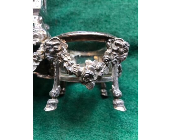 Double silver salt cellar with empire decorations, masks and floral crowns. France.     