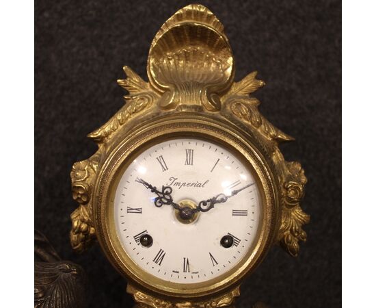 French clock in bronze and gilded antimony