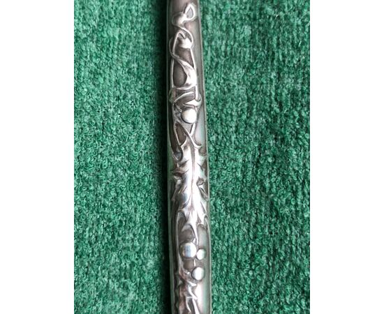 Silver pen with embossed art nouveau oak leaf plant decorations.     
