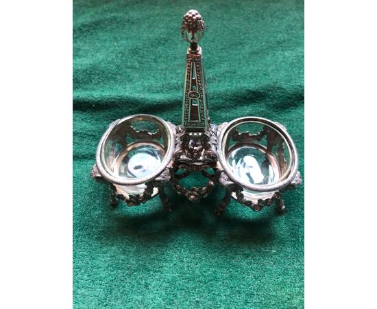 Double silver salt cellar with empire decorations, masks and floral crowns. France.     