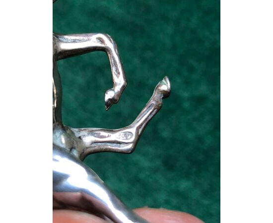 A silver sculpture depicting a small trotting horse Italy.     