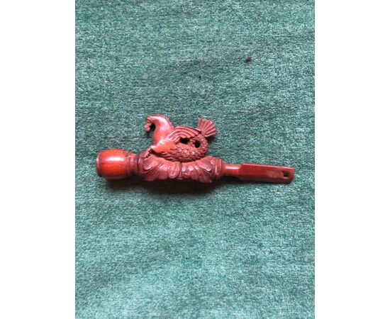 Boxwood pipe engraved with a fantastic animal figure and stylized plant elements.     