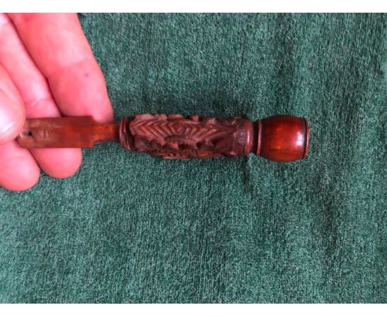 Boxwood pipe engraved with a fantastic animal figure and stylized plant elements.     