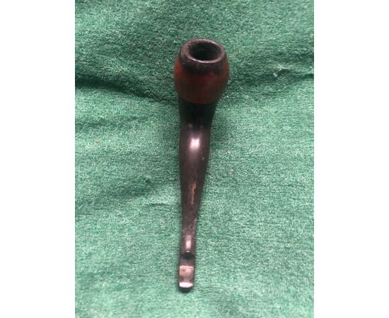 Wooden and bakelite pipe depicting a female leg.     