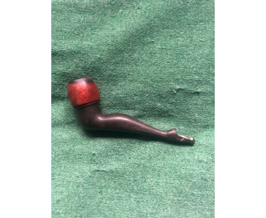 Wooden and bakelite pipe depicting a female leg.     