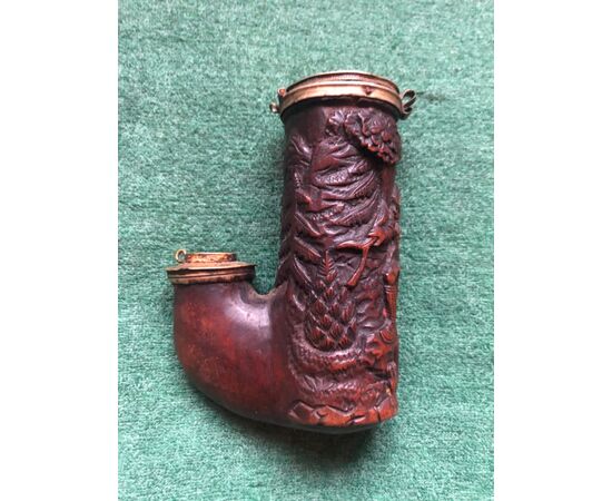 Wooden pipe carved with hunting scene.     