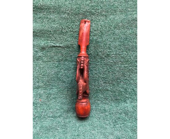 Boxwood pipe engraved with a fantastic animal figure and stylized plant elements.     