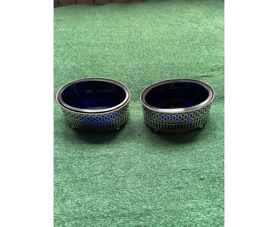 Pair of silver salt cellars with geometric motifs. Sterling punch.     