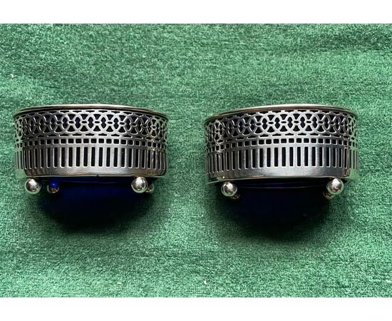 Pair of silver salt cellars with geometric motifs. Sterling punch.     