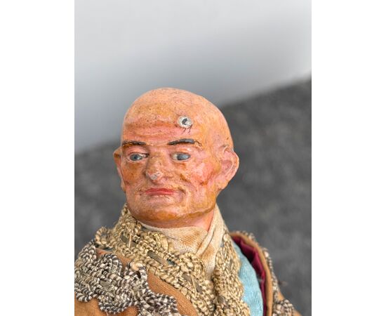 Neapolitan nativity figurine, male figure. Head in terracotta with glass eyes.     