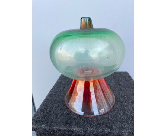 Globular vase in iridescent glass on a truncated cone base.Escribed logo BS.Murano     