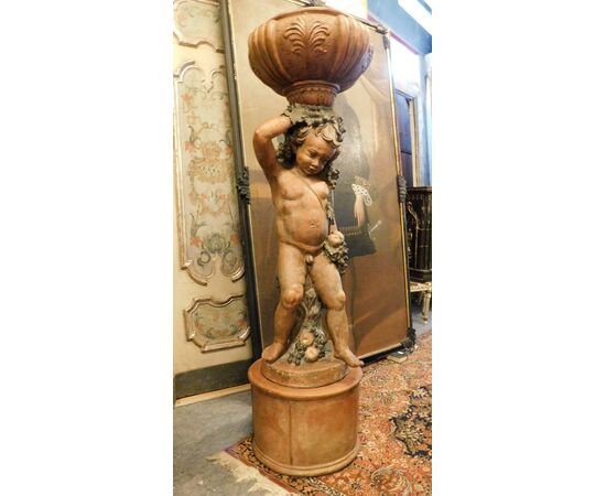 dars435 - putto vase holder in terracotta representing Bacchus, cm 50 xh 176     