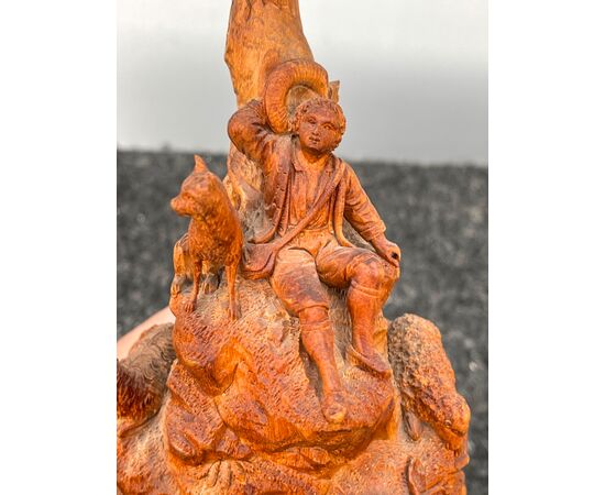 Soft wood sculpture depicting a shepherd with sheep in a rural environment.Germany     
