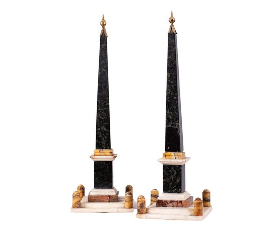 Rome, 18th century, Pair of obelisks Polychrome marbles with base structure and crown of lanceolate leaves.     
