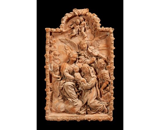 High relief in terracotta depicting the Madonna with Child and Saint XVIII century     