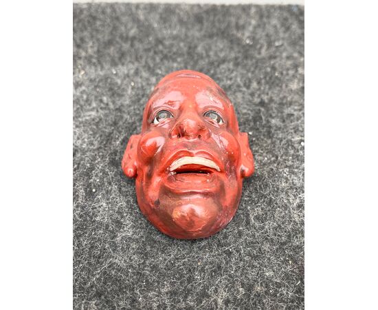 Lacquered papier-mâché mask with glass eyes. Japan.     