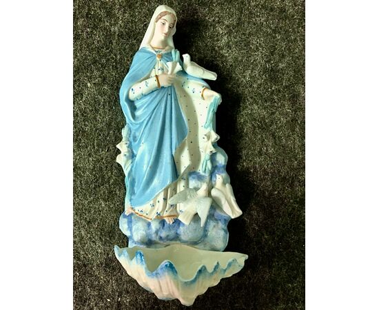 Holy water stoup in bisque porcelain depicting the Madonna with doves. France.     