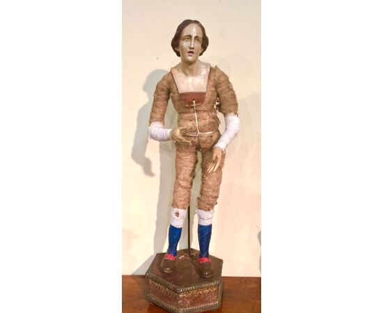 Sculpture with face in terracotta, glass eyes, hands and legs in wood.Original base.Naples     
