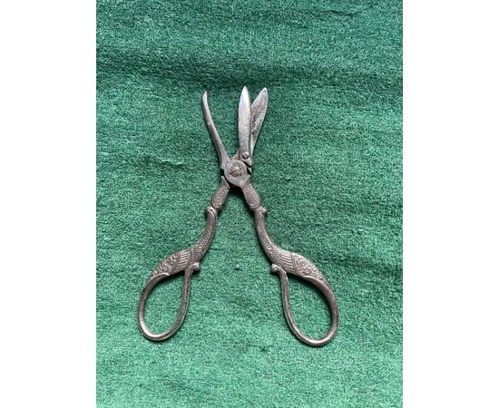 Metal midwife scissors for metal umbilical cord decorated with stylized stork.     