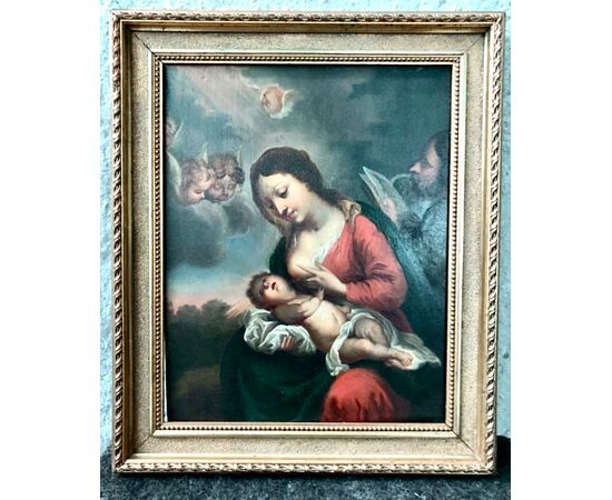 Oil painting on wood with Madonna nursing the Child Jesus Italy.     