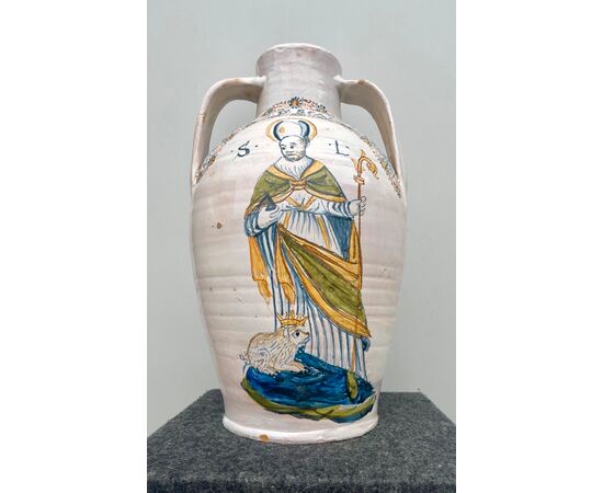 Large double-edged majolica vase with figure of Saint and stylized plant motifs.Castelli d&#39;Abruzzo.     