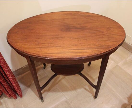 Oval coffee table with four tapered legs