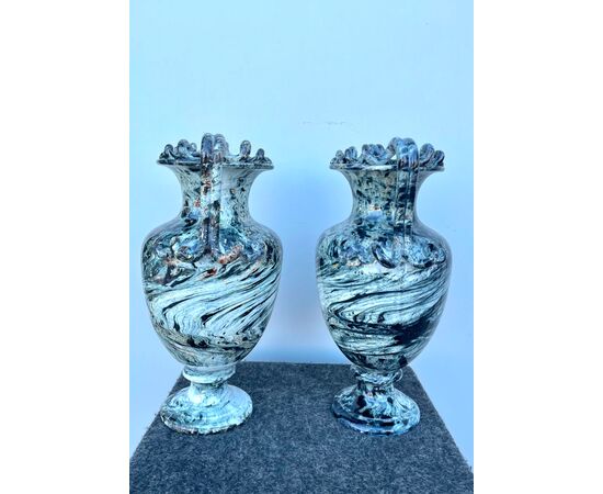 Pair of majolica vases with two serpentine handles and marbled decoration.     