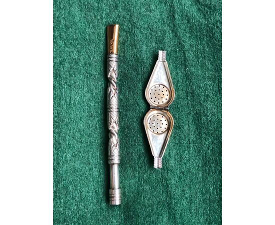 Sprinkler for holy water in silver metal with geometric decoration and unscrewable head.     