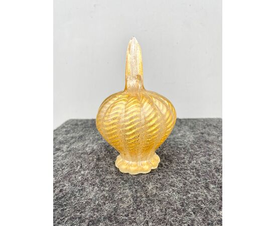 Jar in heavy gold corded glass with small circular grip and elongated spout.Barovier     
