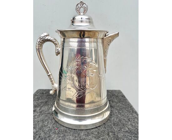 Silver plate chocolate pot with engraved and embossed floral motifs United States.     