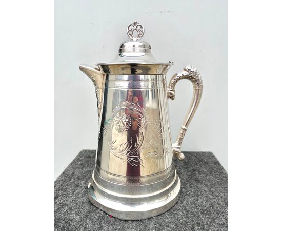 Silver plate chocolate pot with engraved and embossed floral motifs United States.     