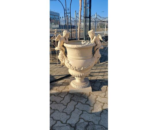 Cast iron vase with Liberty style cherubs     
