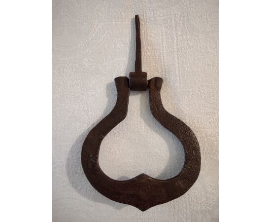 Small door knocker in forged and chiseled iron     
