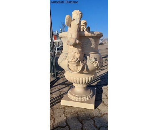 Cast iron vase with Liberty style cherubs     