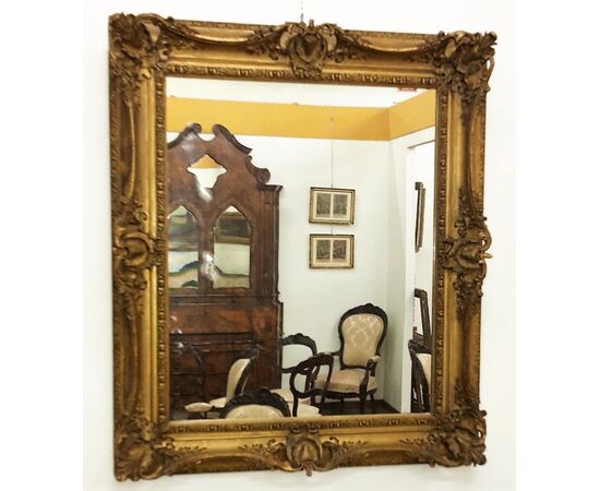 Mirror in restored gilded plaster