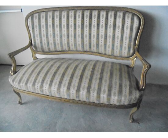 Sofa in gilded wood