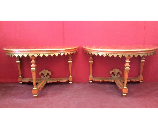 Pair of lacquered and gilded consoles
