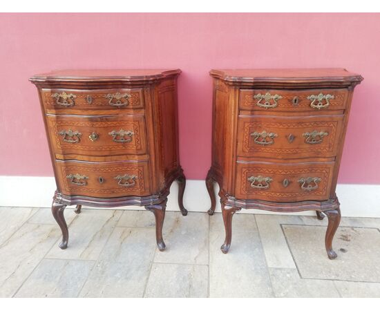Pair of wavy bedside tables     