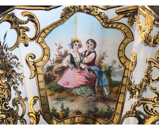 Openwork and gilded ivory fan with Pavese in paper with watercolor prints with gallant and country scenes. France.     